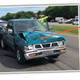 Illustration for article titled Wildly Improbable Nissan-on-Nissan-on-Nissan Wreck Reveals Universe to Be a Simulation